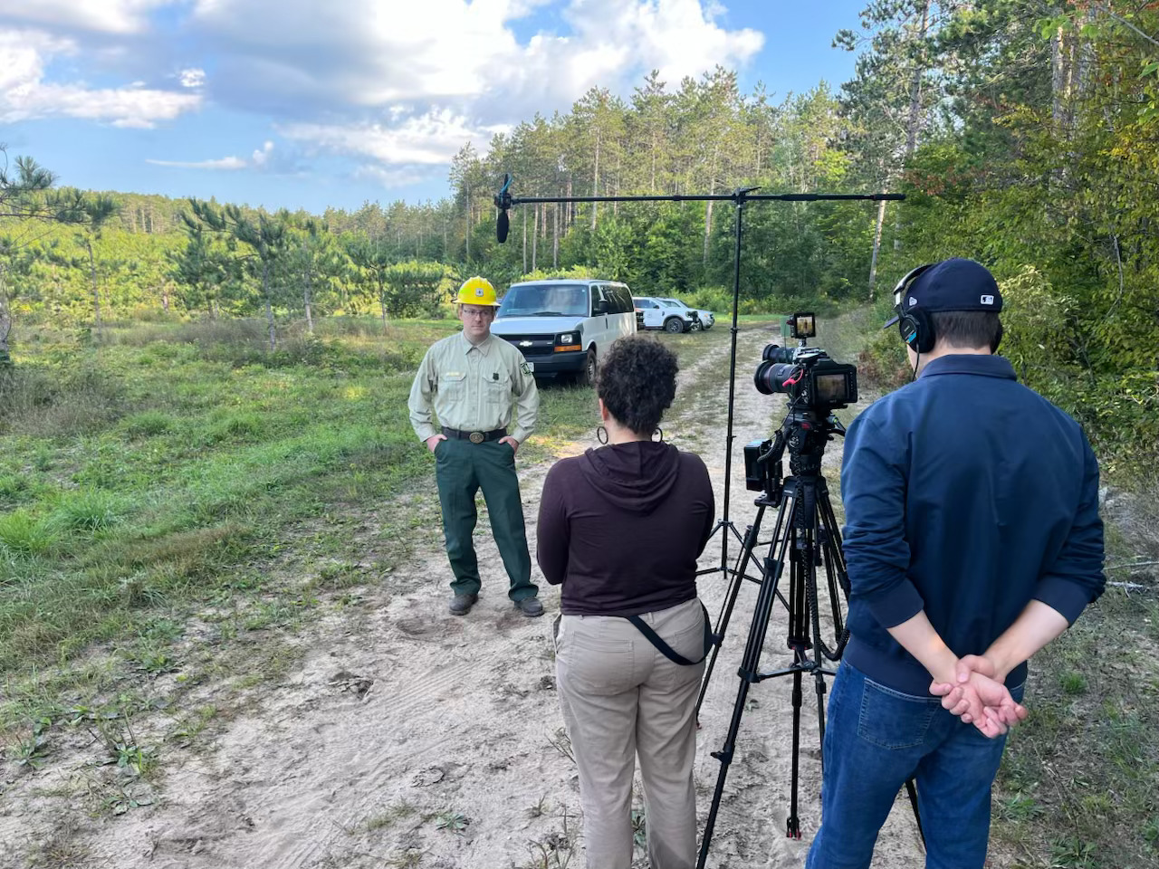 Amari on location conducting an interview with a film crew in Michigan