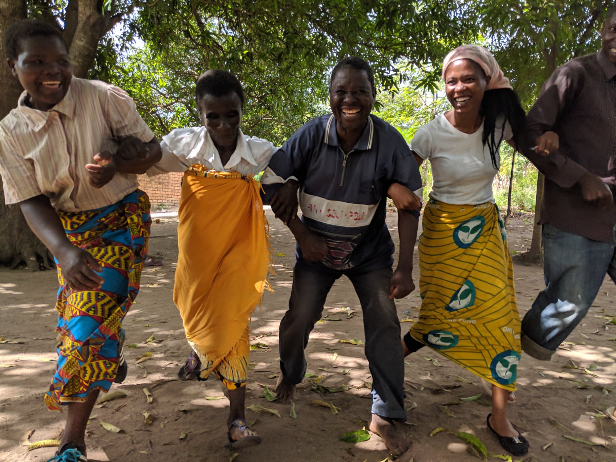 Farmers playing a repayment game during a group meeting in Malawi